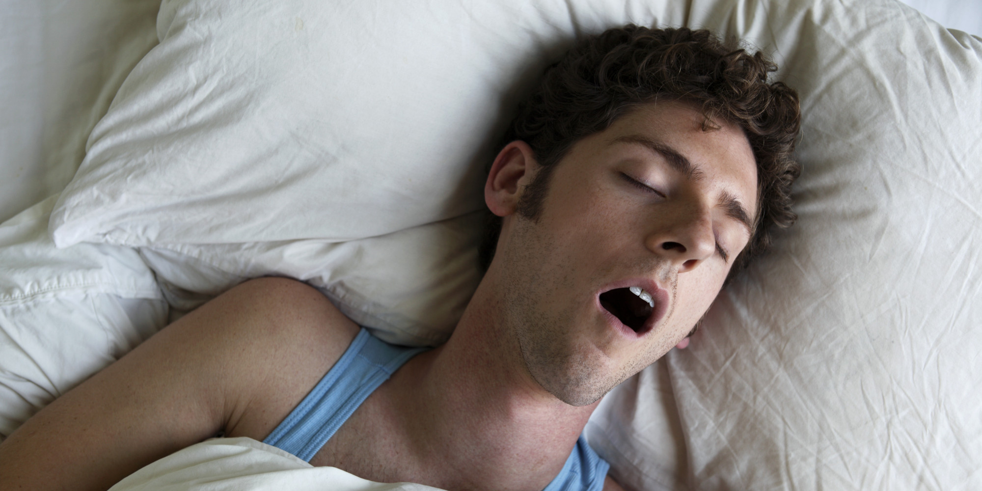 Man sleeping and snoring, overhead view